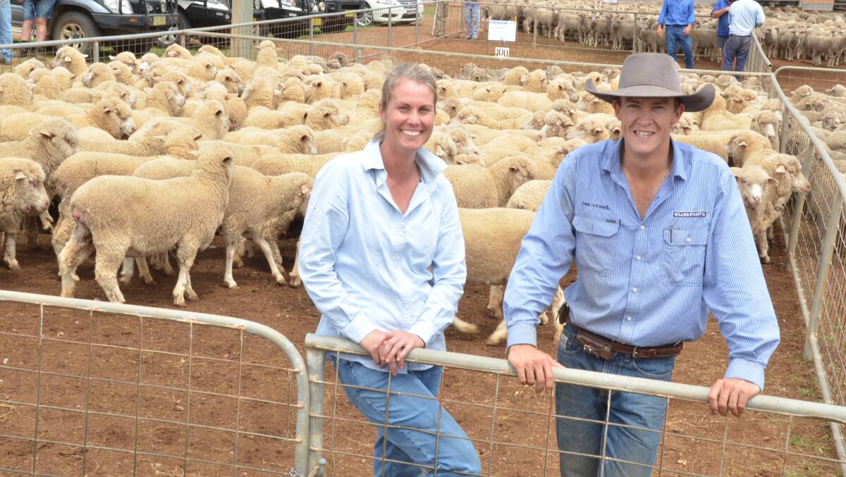 TOP PRICE: Alison Kensitt, Redbank Park, Dunedoo, NSW, pictured with Lachlan Croake, Milling Stuart, gained the top Merino ewe price at Dunedoo, at $265 a head.