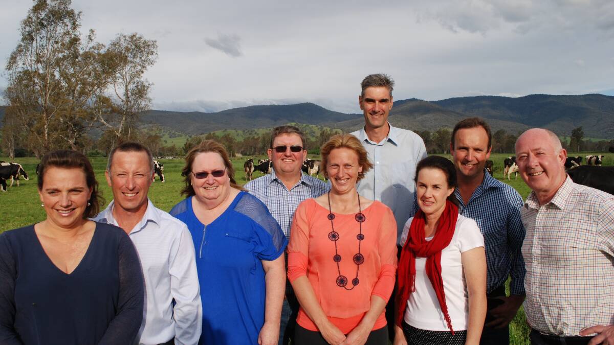 The four farming families Sarah and Stuart Crosthwaite, Kerrie and Patrick Glass, Belinda and Scott McKillop, and Alice and Ian Holloway, with dairy consultant Patten Bridge.