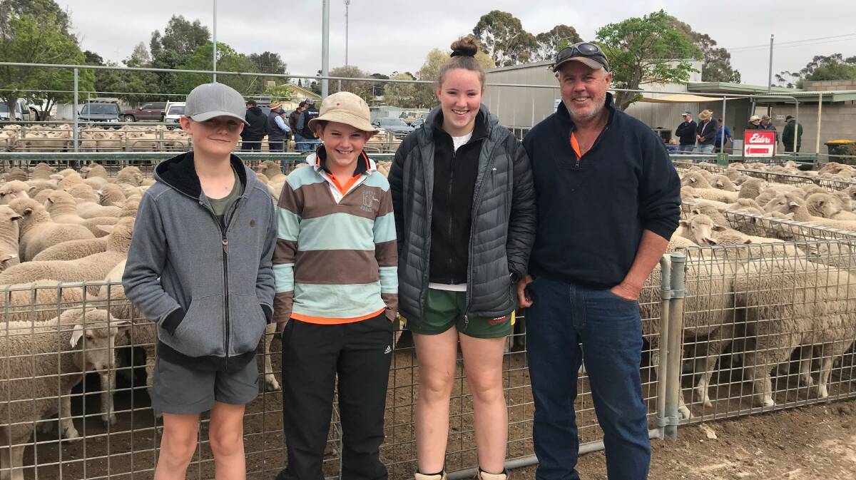 SUCKER-SELLER: Sandy Howieson, Kyle, Chloe and Peter OBrien, Speed, received the top price of $260 a head for sucker lambs at Ouyen's recent sheep sale.