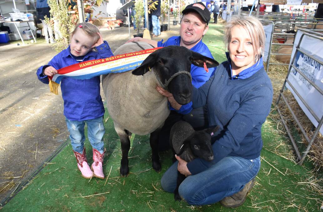 Saige Sutherland, 4, with parents Jon Sutherland and Jody Zoch, Sayla Park, Kilmore, and the supreme champion Suffolk, and its one week-old lamb at foot.