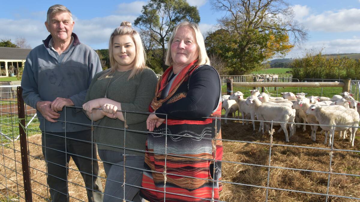 Allaye Australian Whites stud principals Allan and Gaye Donovan, and granddaughter Jessica Donovan, in front of some of their stud ewes, at Sheep Week 2017. Photo by Joely Mitchell.