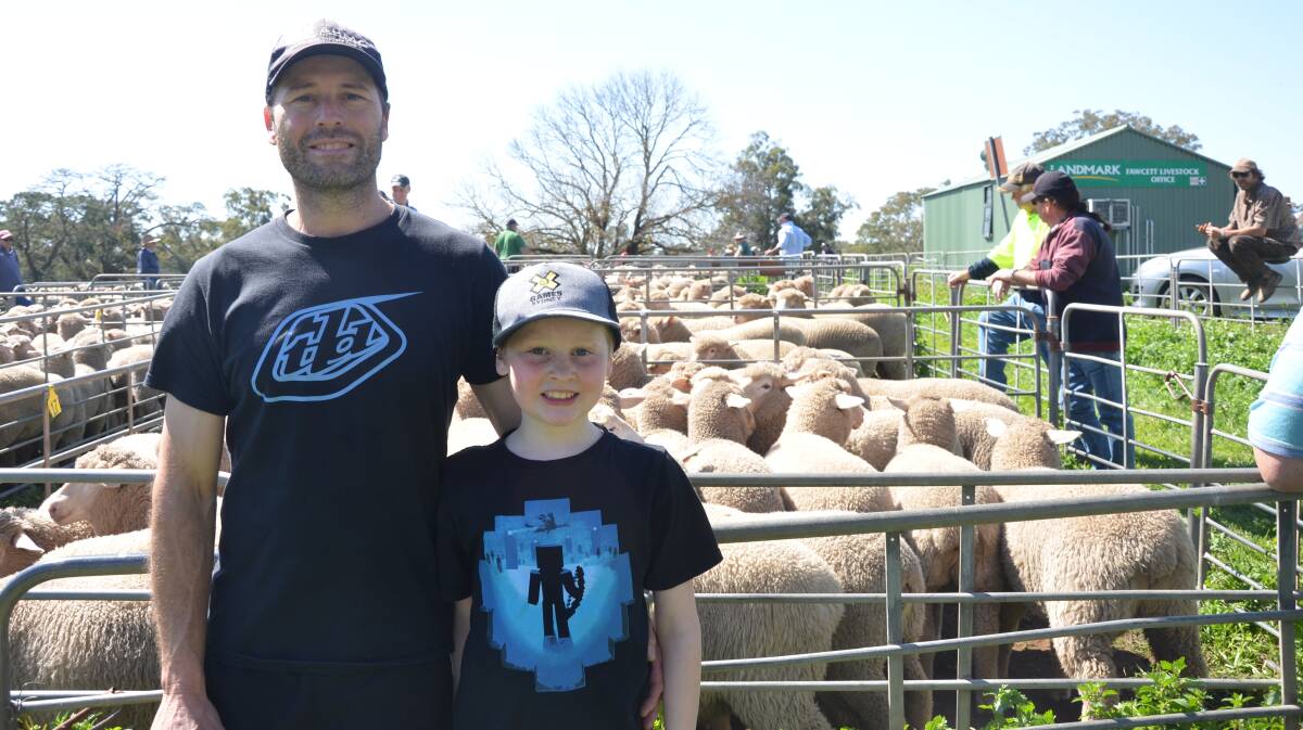 LOCAL VENDOR: Andy Sharrad, Mount Pleasant, SA, and son Patrick, 9, had the top pen at Mount Pleasant, making $198 for a pen of 28 lambs at the sale.