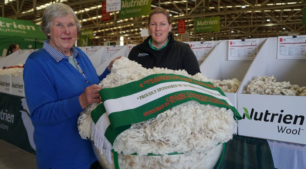 Shalimar Park stud principal Alison van Eyk, Walcha, NSW, and Nutrien Ag Solutions wool account manager and competition convener Candice Cordy with the champion fleece. Picture by Joely Mitchell