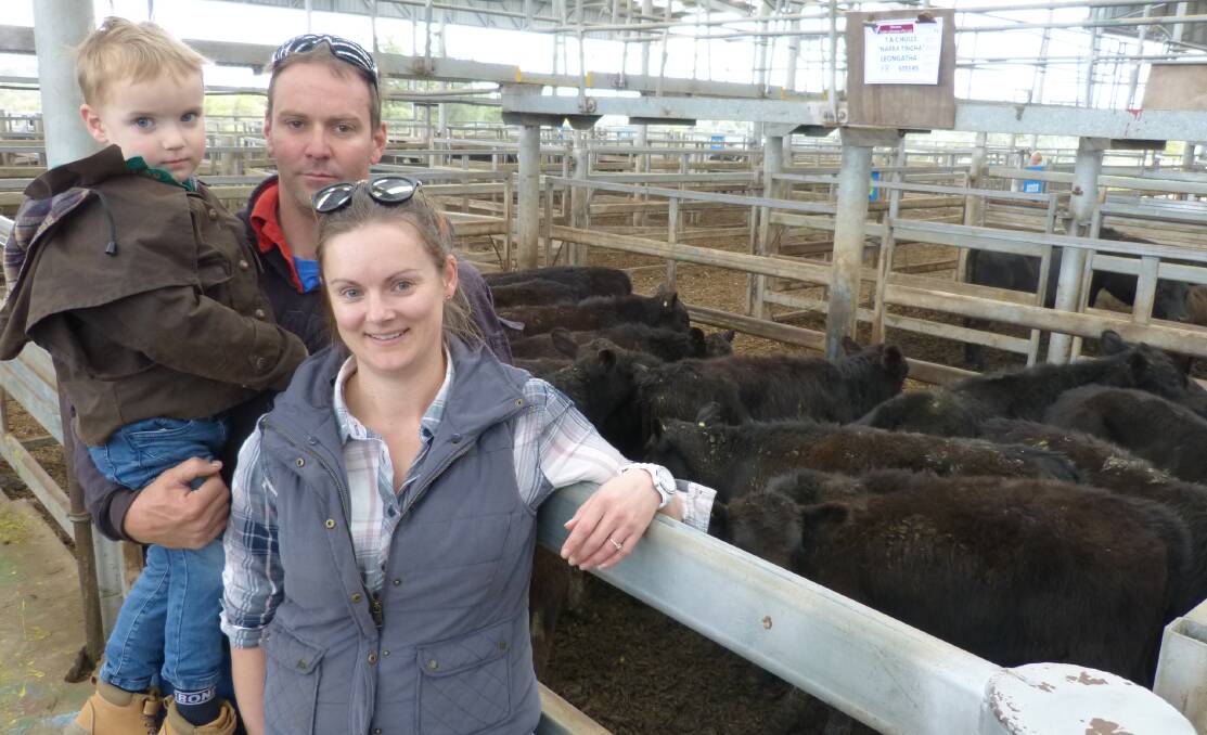 FAMILY VENDORS: Michael and Sarah Hulls, Leongatha, with Riley, 3, sold 260 steers and heifers at Leongatha's store sale last week. Photo by Bryce Eishold.