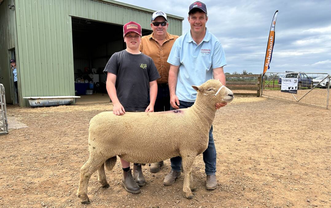 Angus Summers and David Russell with their new ram and Fairbank's Chris Badcock.