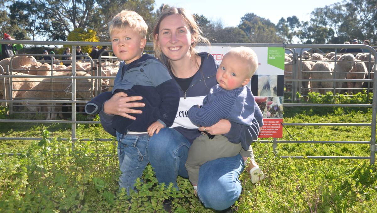 Ella Lindner with Kade, 2, and Remy, 11 months, Palmer, SA, at the Mount Pleasant, SA, sheep market recently. Picture by Vanessa Binks 