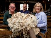 CAUSE: Brendan and Susan Finnigan, Kia Ora Merino stud, Winslow, with Kyle Smitten, Fox & Lillie Rural (middle), are donating the proceeds of their wool sale to the Ukraine humanitarian crisis. Photo by Chris Doheny.