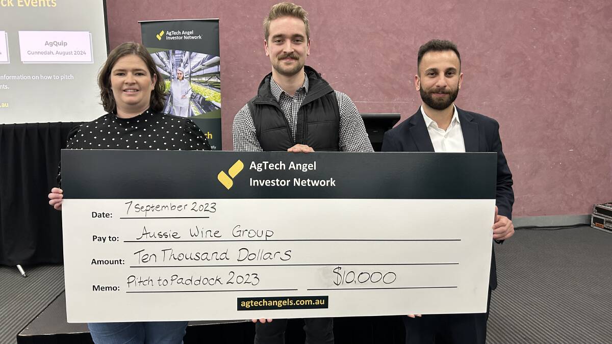 I Heart Farming founder and competition judge Natasha Lobban, Aussie Wine Group production and design manager Zac Villis and AgTech Angel Investor Network founder and facilitator Sam Almaliki with the $10,000 cheque. Picture by Joely Mitchell