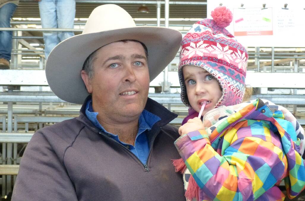 Xavier Kirk and daughter Macey, Old Tallangatta, watched the sale of cows and calves at Wodonga, where agents yarded 3122 cattle.