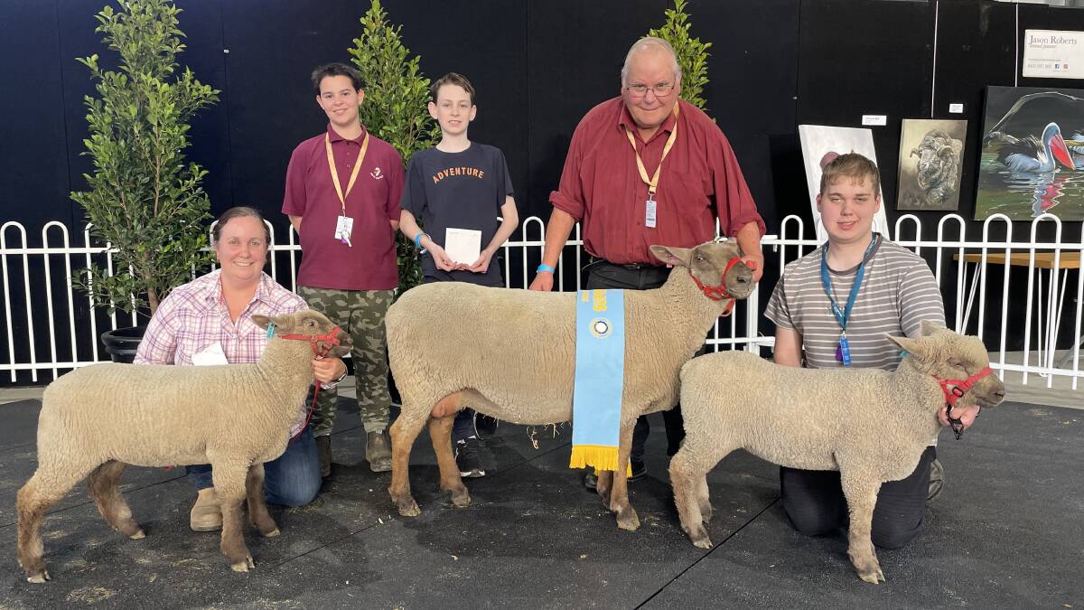 Suzanne Holmes, Damon, Isaac and Barry Shalders and Jack Holmes, Willow Drive South Suffolk stud, Grassmere, with the supreme South Suffolk exhibit and her lambs. Picture by Joely Mitchell 