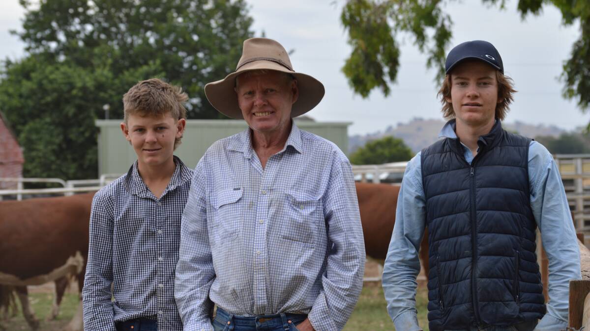 FAMILY VENDORS: Ben, Tony and Tom Reardon, Brooklyn Pastoral, Mansfield, in front of some of their Hereford weaners that will be sold at Wodonga in the New Year. Photo by Stephanie Evans.