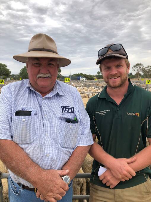 SHORN LAMBS: Peter Ellis, BUR, with Darcy Lanson, Longully, Burrumbuttock, NSW, who sold 125 shorn lambs to a top of $306 at Corowa, NSW.