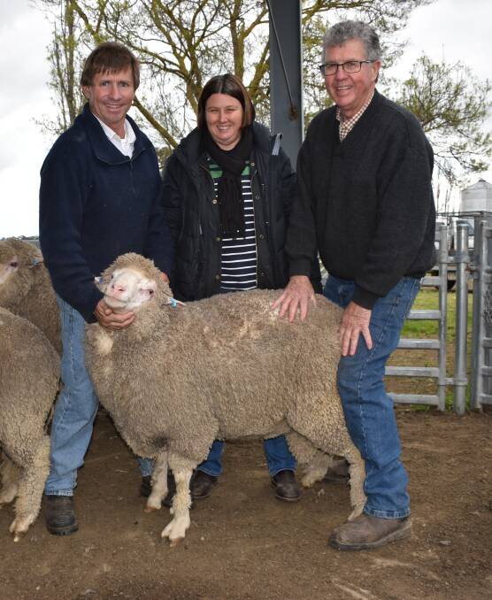Phil and Jackie Muecke, Woodebo, Penola, SA, purchased five rams at the sale. They are pictured here with Phil Toland, Toland Merinos, and one of their rams.