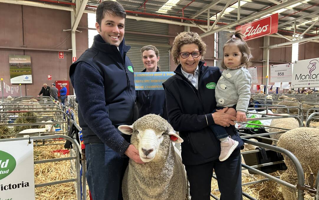 Sweetfield Corriedale stud's Leigh Ellis, Casey Tomkins, Bron Ellis with her granddaughter Gemma, and the supreme champion Corriedale exhibit. Picture by Joely Mitchell