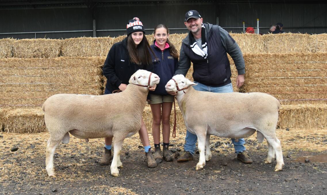 Rory and Remi Baker, Booloola, and buyer of the top-priced lot Martin Harvey, Paxton stud, Western Flat, SA, with the two rams he purchased (top-priced ram is on the right). Picture by Alastair Dowie