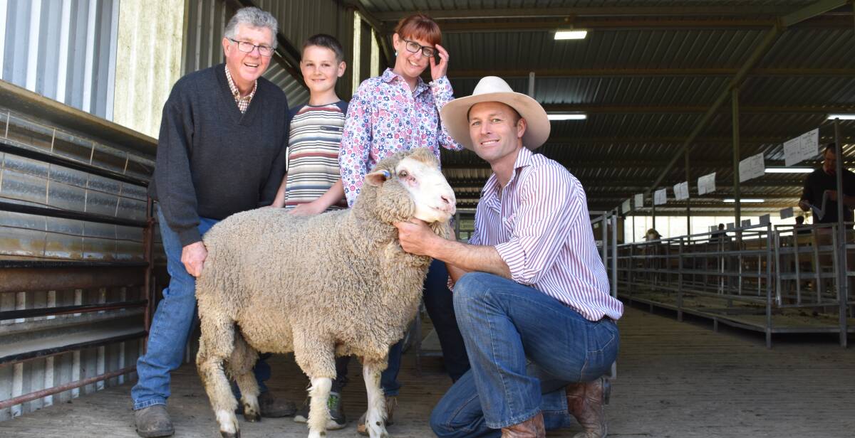 Toland Merinos' Phil Toland, Charlie Thompson, Anna Toland, and Simon Riddle, with the top-priced ram that was purchased by Rob Martin, Fowles, Longwood East.