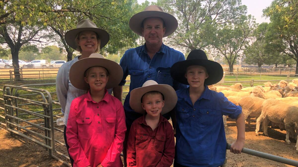 FAMILY TOPS: Kellie and Andrew Crossley, Kapunda, Deniliquin, NSW, with Lucy, 9, Will, 6 and Sam, 11, who topped the first-cross ewe section of a Deniliquin sale recently.