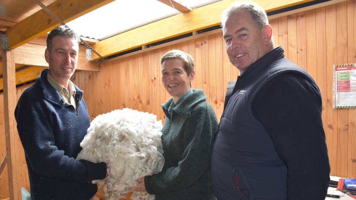Allan and Carol Phillips, Deddington, Tas, with Roberts Tasmania wool manager Stewart Raine.