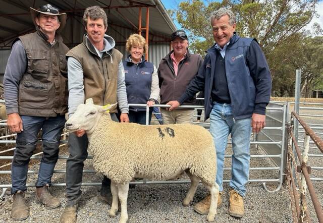 Basin and Tim Jorgensen, Mertex, Liz and Pete Russell, Tullamore Park, and Jason Rice, Elders (second from right), with the top-priced ewe of the sale. Pictures supplied