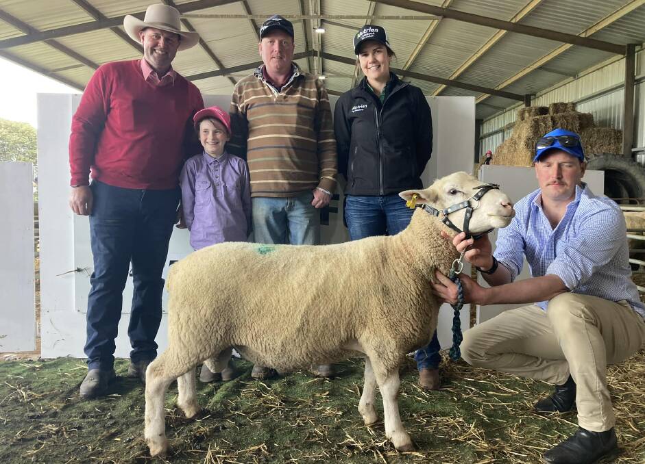 Jarrod Dubignon, Elders, Emily and Ian Armstrong, Tatyoon, Sadye Wines, Nutrien, and James Porter, Westleigh White Suffolk stud, Lake Wongan, with one of the top-priced rams, Lot 18. Picture supplied.