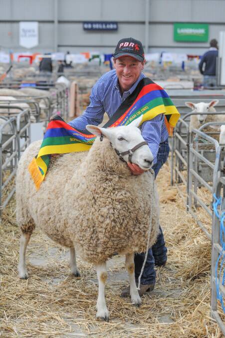 ON THE BORDER: Ross Jackson, Jackson Farming, Moyston, with the stud's Border Leicester ewe which was awarded supreme Australian long wool exhibit at last year's ASWS in Bendigo. Photo by Laura Ferguson.