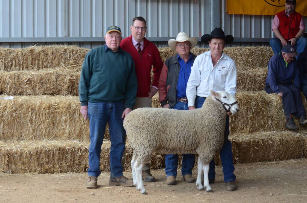 TOP SELLER: Barry Hobson, Hobson Farming, Ercildoune, with Ross Milne, Elders, and David and Ross Jackson from Jackson Farming at Moyston, with the top priced ram which sold for $5750.