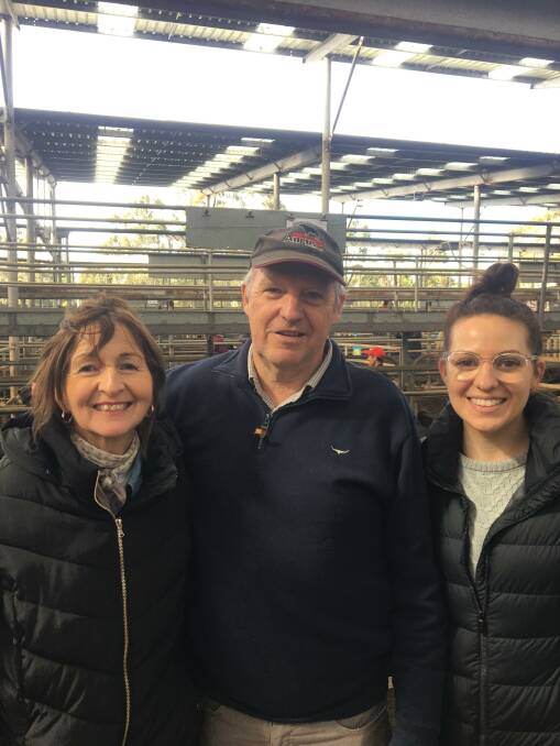 BIG RUN: Kathleen and Richard Telling, who farm at Woodside, with daughter Madeleine Glenane sold 160-head of young cattle at Leongatha and were happy with the prices they brought. Photo by Jack Ginnane