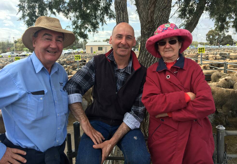 MARKET DAY: Rodwells Wangaratta's Peter Dargan with Garry Bennett and his mother June from Everton Upper, who sold 81 lambs to a top of $169.20 at Corowa. Lamb numbers were up, with 12,000 new season lambs. 