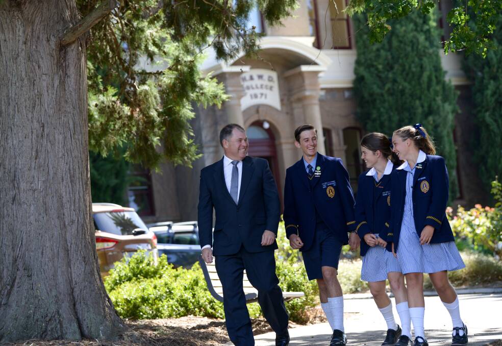 RESPECT: Principal Dr Andrew Hirst and boarding students James Sutherland, Year 11; Hannah Russell, Year 11, and Lucy Roberts, Year 8.