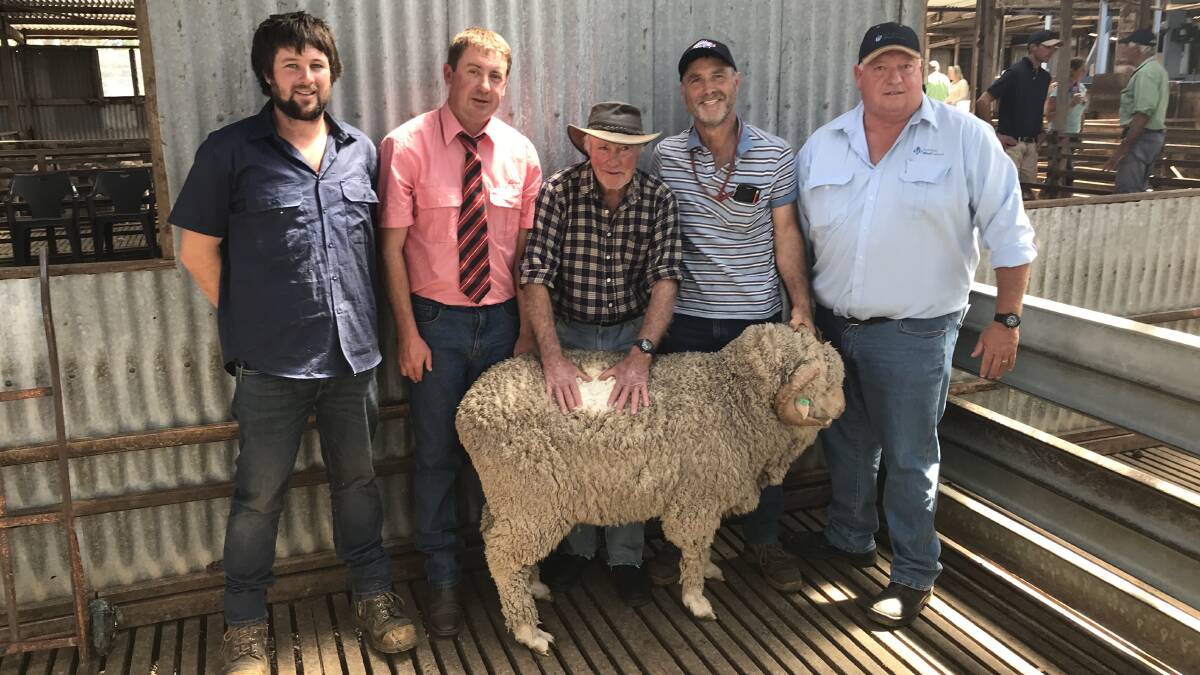 RESULT: Troy Johnson of Echo Cottage, Damien Whiteley of Elders, buyers VM & LS Bailey, and Tony Bradfield of AWN with the top priced ram that sold for $3900.