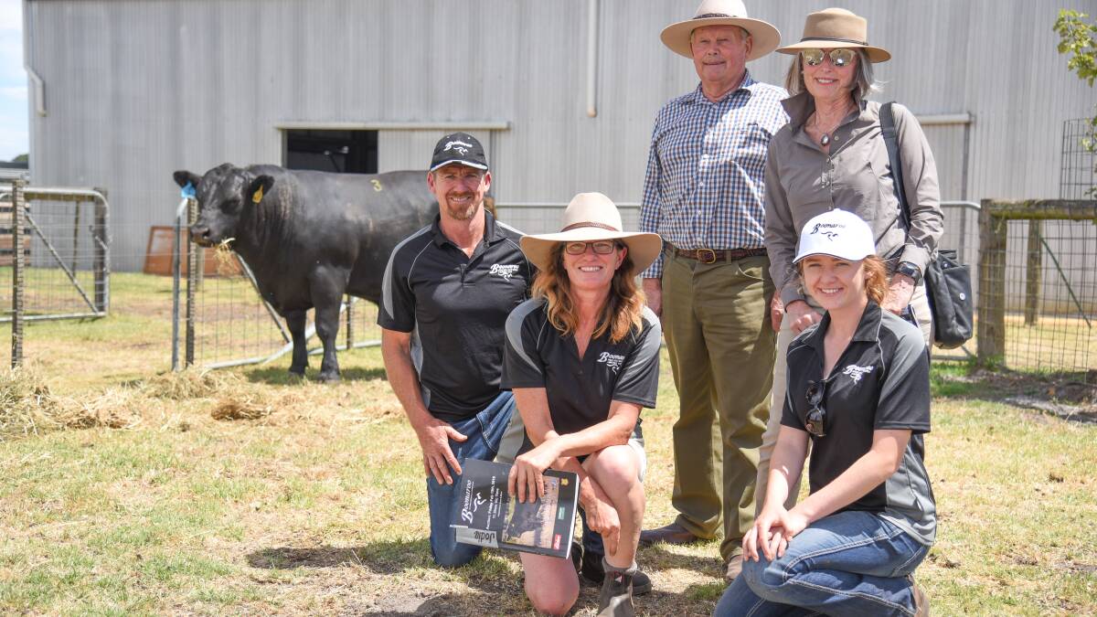DECISIONS: Boonaroo principals Shane and Jodie Foster, with daughter Claire, and top priced buyers Susie and Rob Coulsen at the 2019 bull sale. The stud faced a tough choice whether to run this year's sale on its original date.