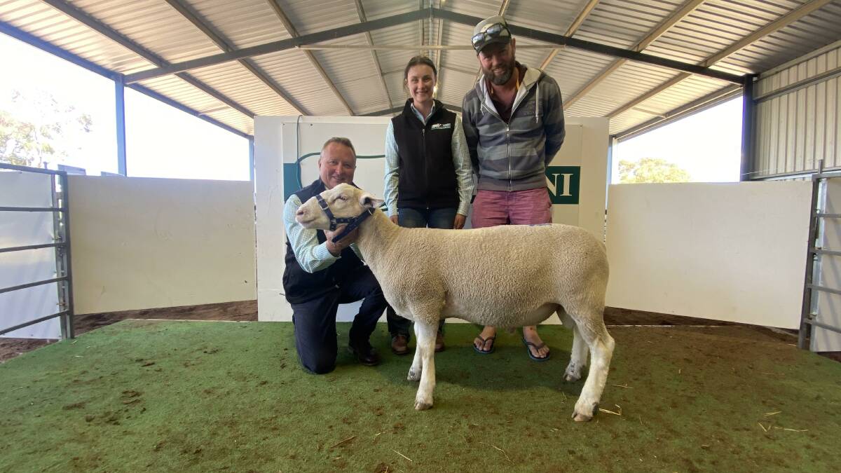 RESULT: Stud principal Craig Mitchell, Chloe Mitchell and Guy Treweek, Induro White Suffolks, Wakool, with the top priced ram that sold for $2400. Photo by Circle Media