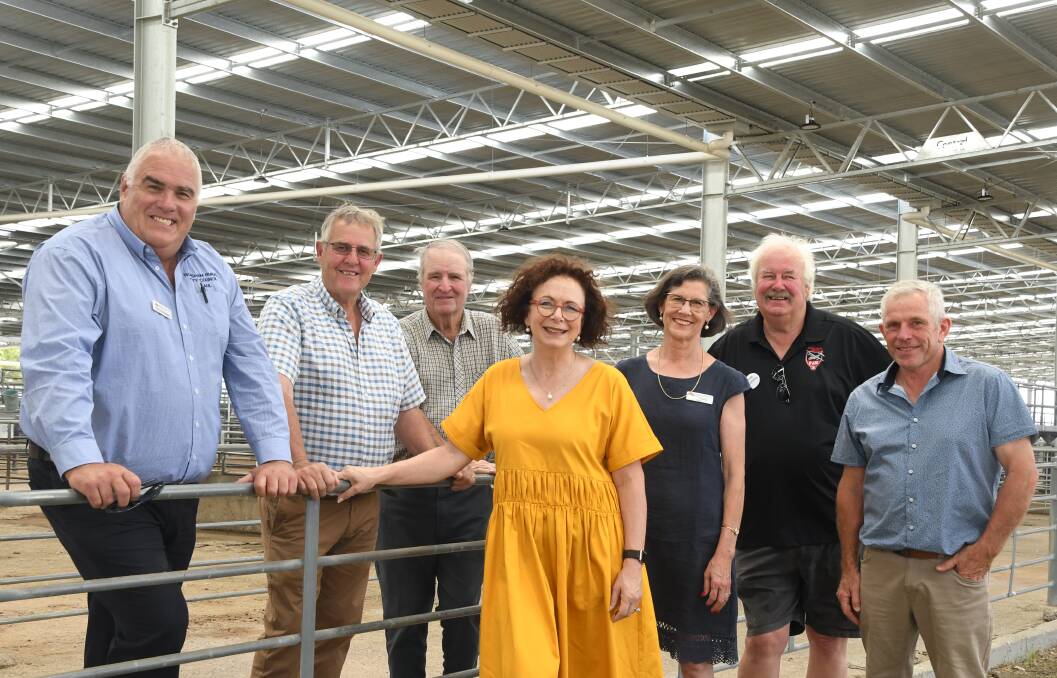 TURNOUT: Paul Christopher, David Grimble, Kevin Pymer, MP Anne Webster, HRCC mayor Robyn Gulline, Neville McIntyre and Ray Zippel under the new roof at the saleyards.