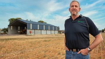 Shed advantage: The Wheelhouse Group's Wes Wheelhouse in front of his 3000 tonne fertiliser shed in Bridgewater, says the extra cost of a pre-cast wall and getting the correct pitch height are important considerations when designing a shed.