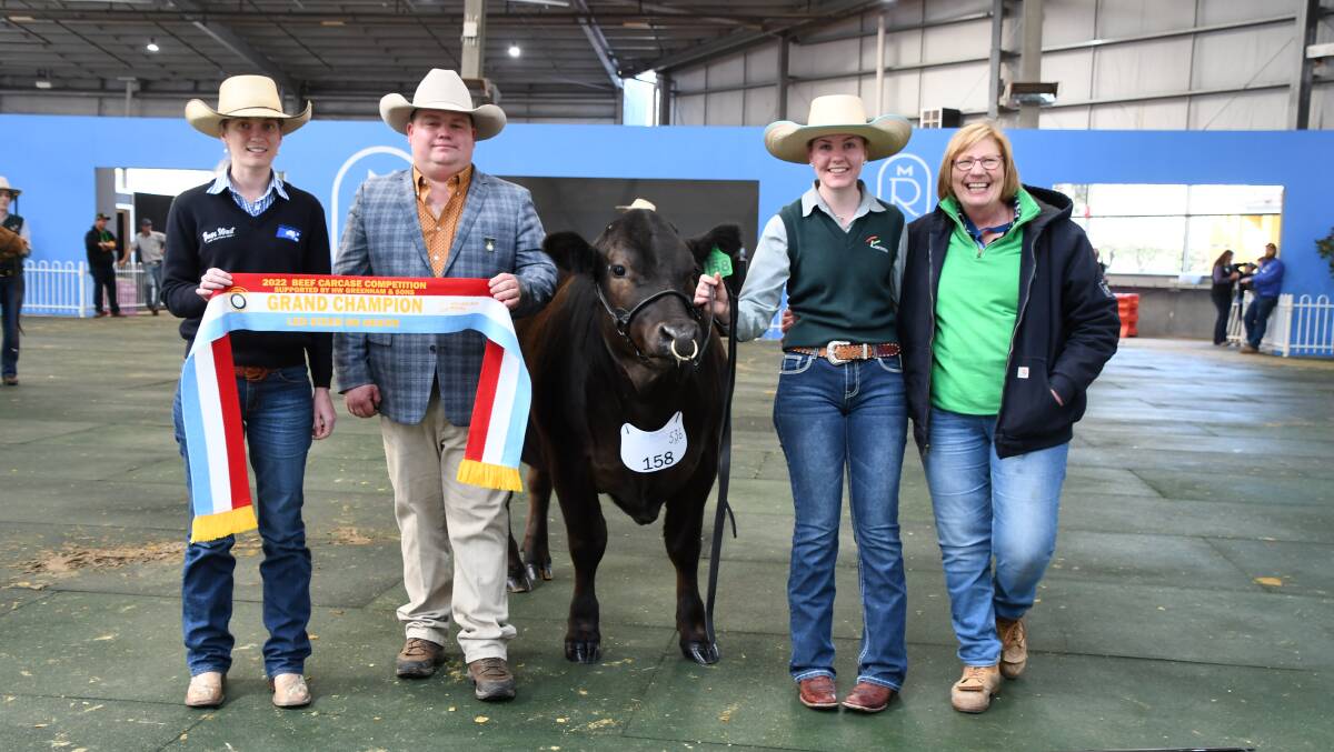 GRAND CHAMPION: Chloe Gould, HW Greenham, and judge Geordie Elliot sashing the grand champion steer from Koonoomoo Cattle Co, held by Bridie Chester, with mum Lyn Chester