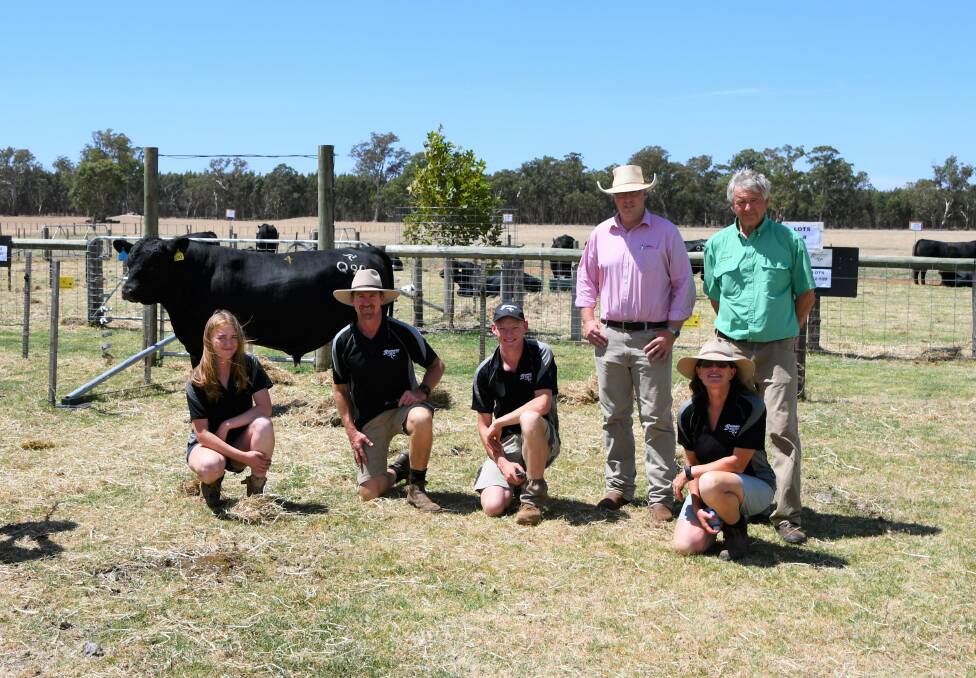 STUD SIRE: Boonaroo's top-priced bull with Claire, Shane, Tom and Jodie Foster (front) and sale auctioneers Ross Milne, Elders, and Andrew Sloan, Nutrien.