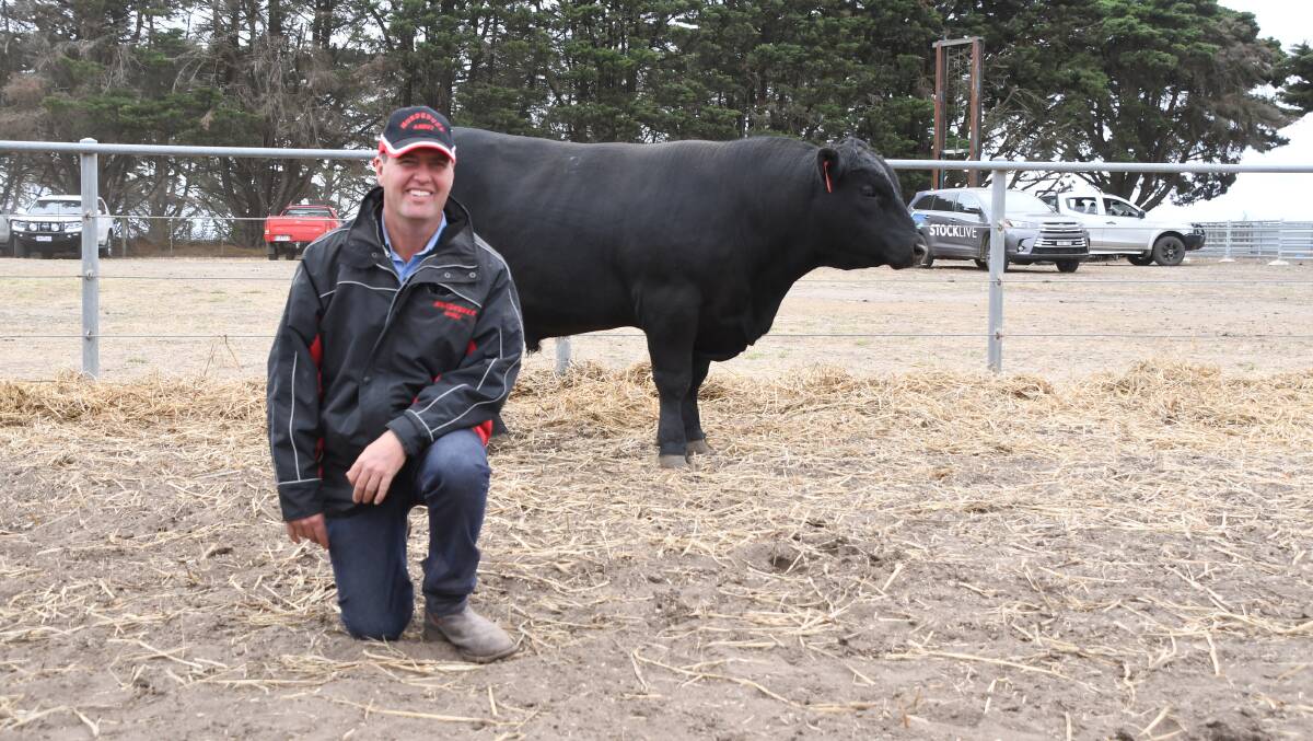 BEST: Murdeduke stud principal Lachie Wilson with the top-priced bull, Lot 2, which was secured by a consortium near Gisborne.