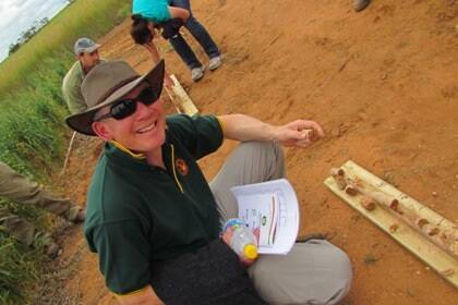 Pic: Ben Jones, Mallee Focus, looks at a soil sample at Ouyen.