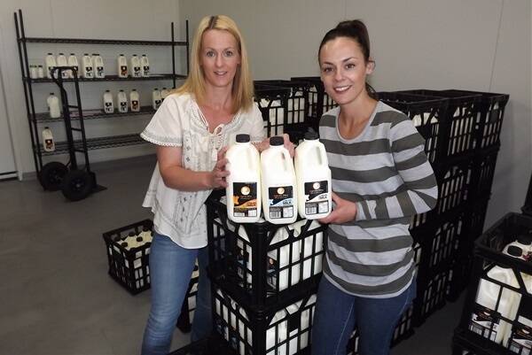 Sisters Gina Britt and Rachael Peterkin with the Inglenook Dairy milk they process at Dunnstown.