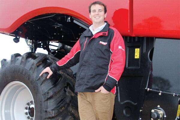 O'Connors Case IH Birchip sales manager Tom Sheridan with a 7120 Case harvester.