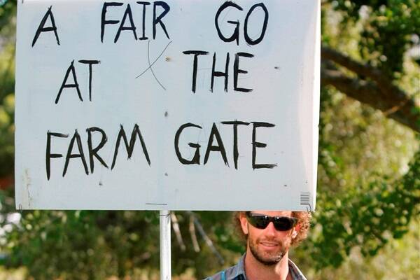 David Black, of 8 Mile Creek, SA, with a protest sign, at one of the Farmer Power rallies in Warrnambool last month.