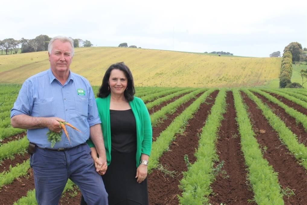 Ian and Gloria Benson in a paddock of carrots which are due to be harvested in February.