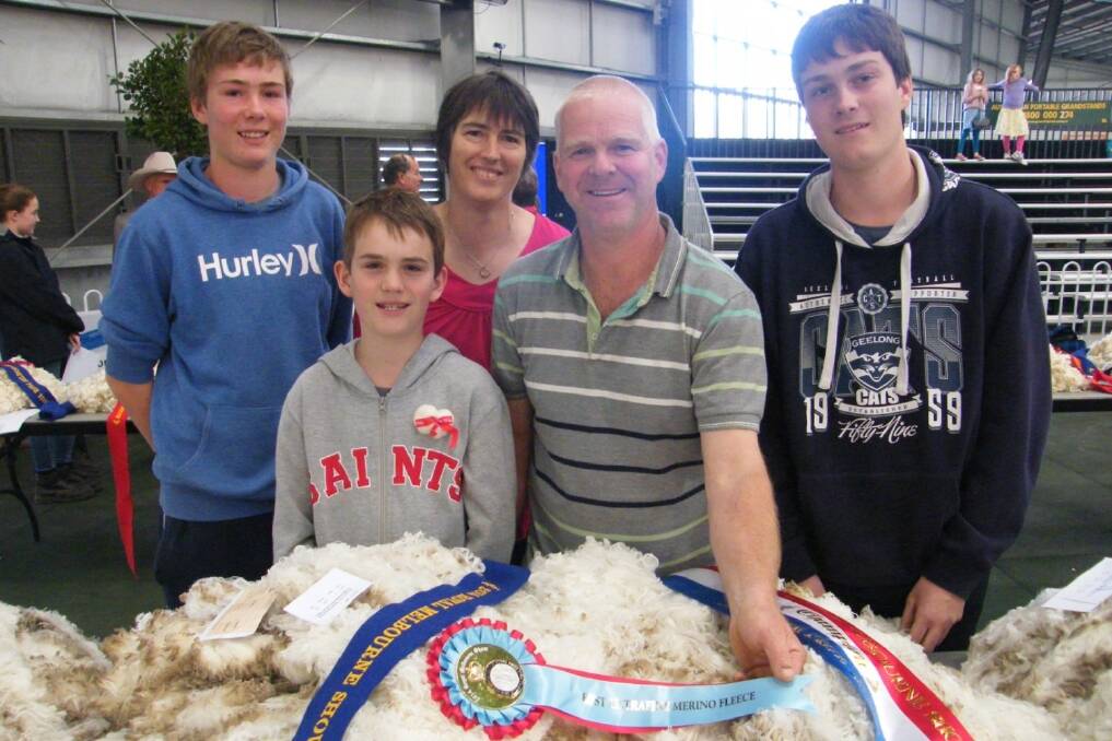 Phil and Kim Hartwich (pictured centre with children Ben, Tim and Chris) and their champion fleece. 