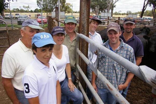 Volume vendors at Euroa store market on Friday Mark and Louise Calvert-Jones, Tonga Station, Mansfield (centre), sold a draft of 66 joined heifers at an average of $847 and to a top of $885, with 121 joined cows to $940, average $851.50, Te Mania blood. They are pictured with Luke Bongiorno and father Paul, Avenel and (from right) employees Troy Mahoney, Tony Scott and Hayden Clark. 