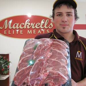 Dylan Everett pictured holding a pack of Dorper lamb chops at Mackrells Elite Meats, Moama. 