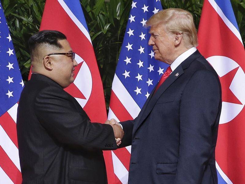 North Korea's Kim Jong-un shakes hands with US President Donald Trump at their summit in Singapore.