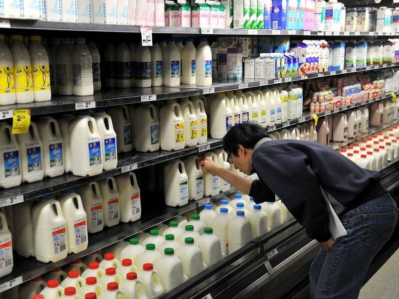 Supermarkets and dairy companies say there are no plans to limit how much milk consumers can buy. (Paul Miller/AAP PHOTOS)