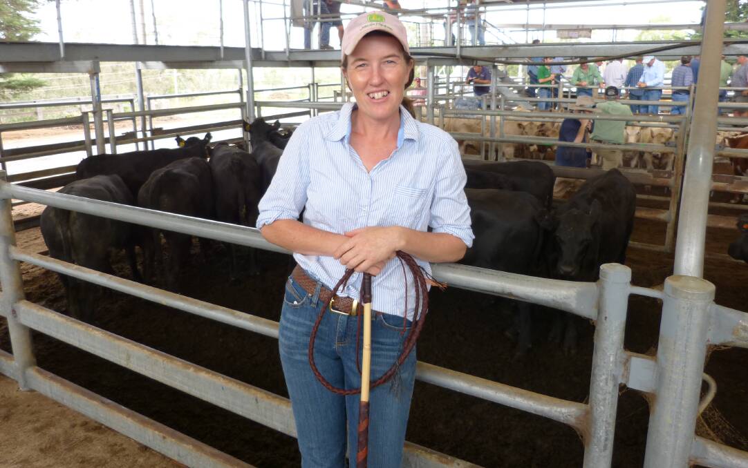 Dianna Hurley-Steed, Wuk Wuk Whips & Leatherwork, proudly displays one of her whips while in front of a pen of Angus heifers she sold at Bairnsdale for $1130.