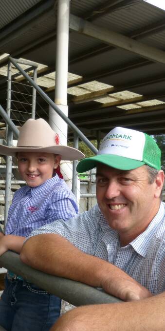 Landmark EGL auctioneer, Jake Fullgrabe, savouring the moment just before the start of their annual autumn weaner sale at Bairnsdale. His daughter Madison looks on.