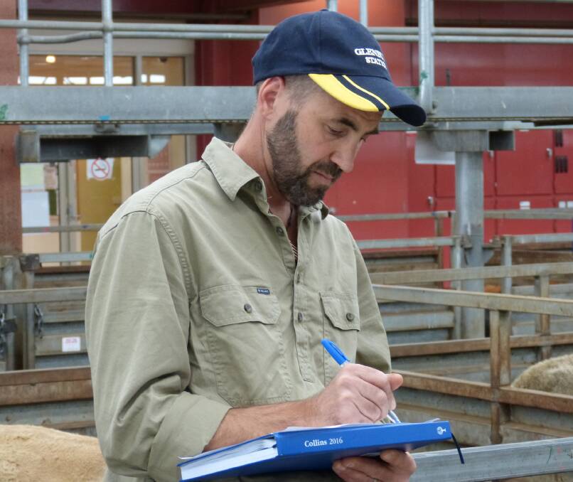 Glenburn Station manager, Michael Weinmann, writes down his prices while selling 44 registered Angus cows, 3&4 years at Pakenham. These PTIC cows sold to $1630.